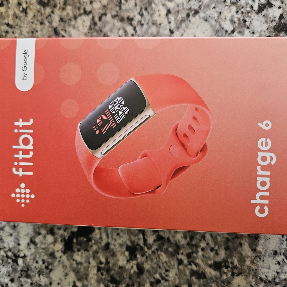 Fitbit Pink Smartwatch with Health Tracking. New Condition.